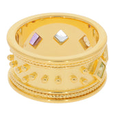Gold ring featuring colorful gemstones and intricate detailing, perfect for elegance and style.